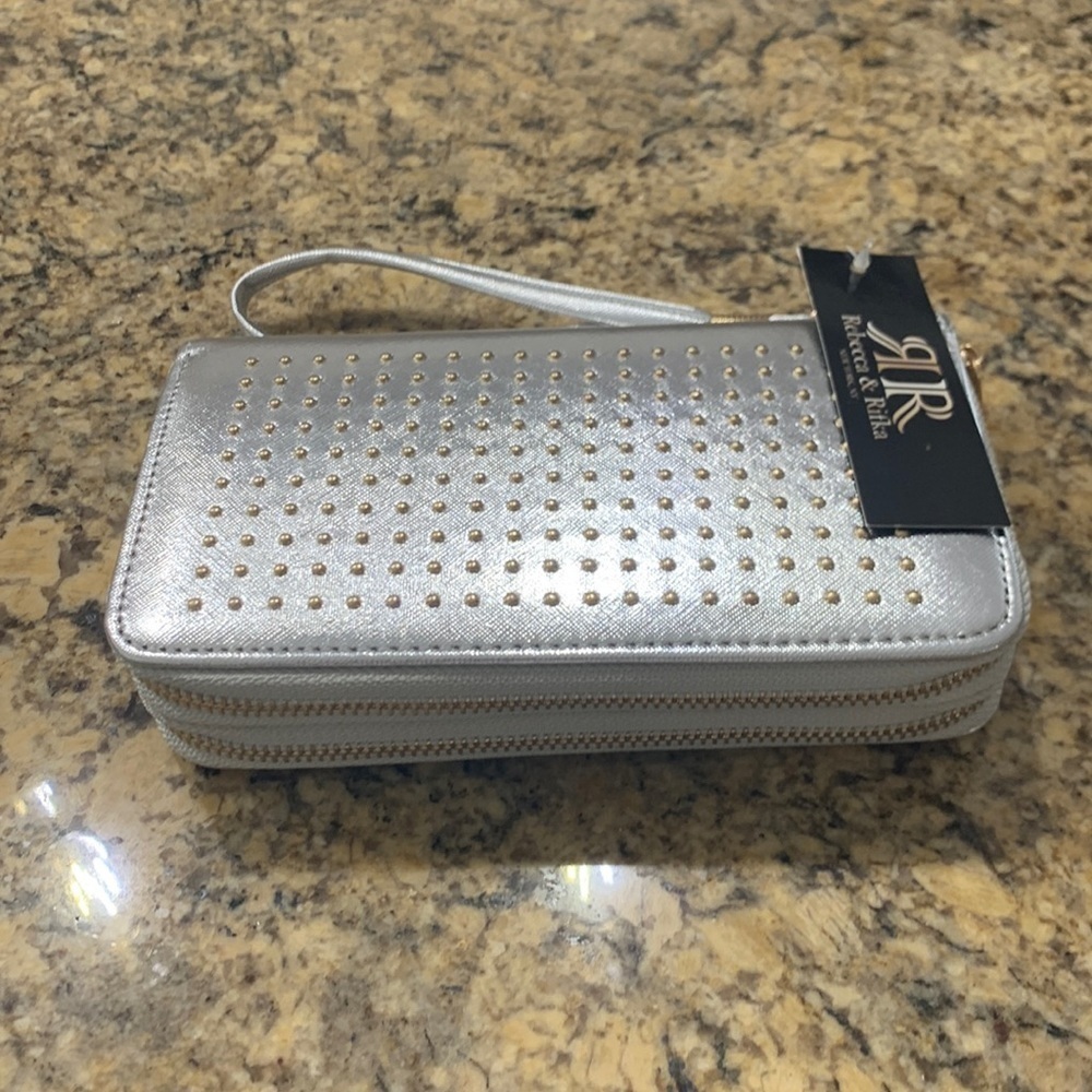 Silver clutch with wrist handle gold studs plenty of interior space NWT
